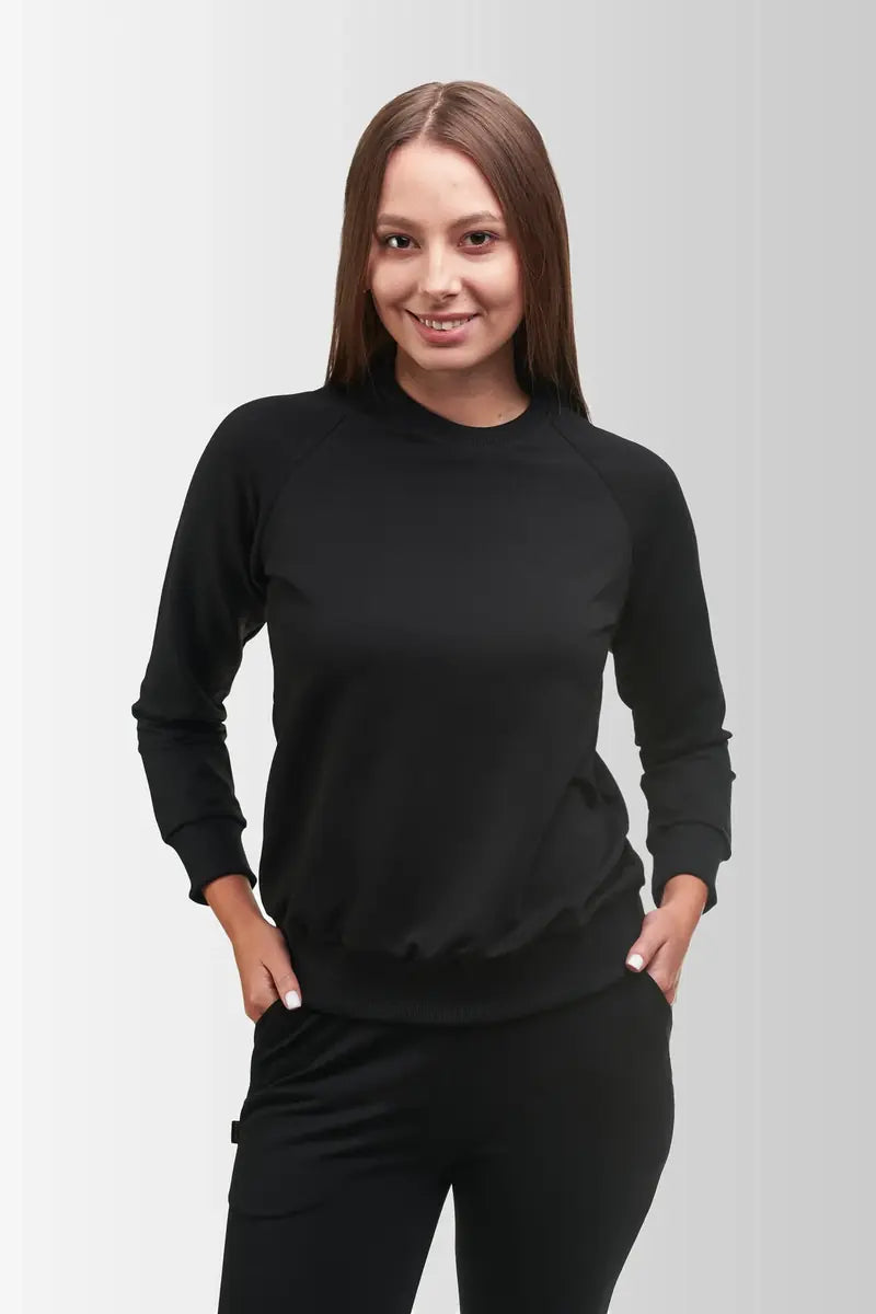 Woman wearing a black VSETEX work sweatshirt
