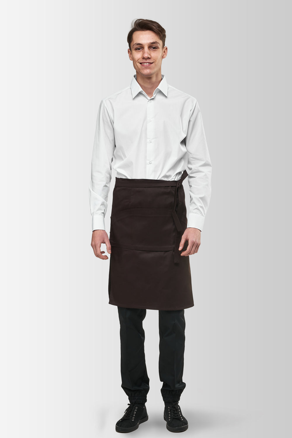 Brown Tiramisu waist apron worn by a male model, front view