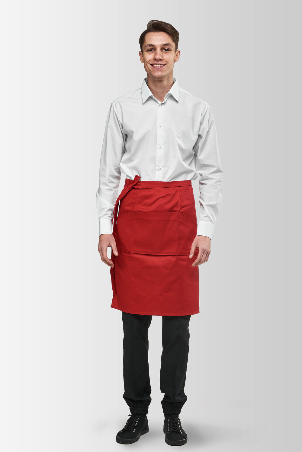 Red Tiramisu waist apron worn by a male model, front view