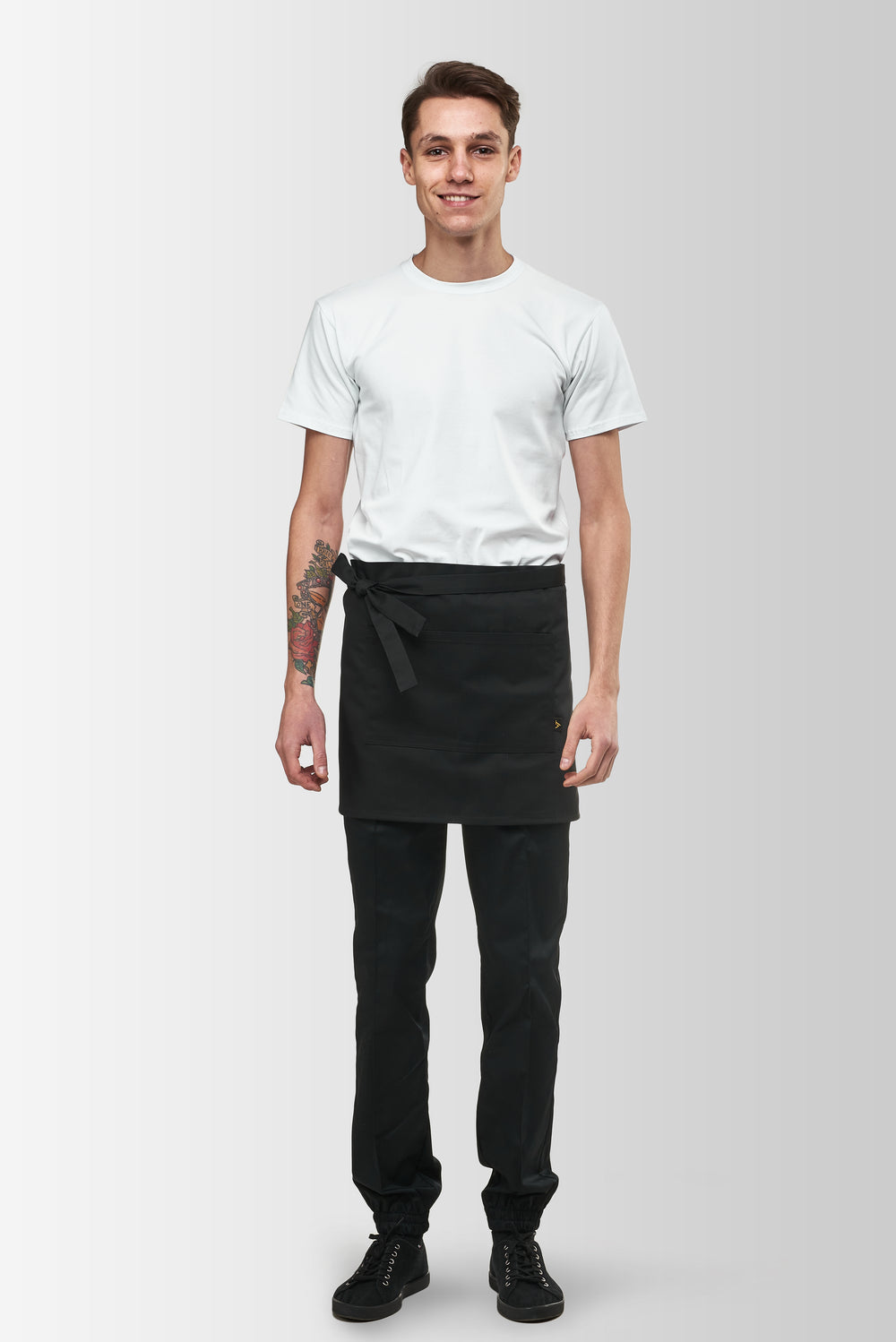 Black Berry short waist apron worn by a male model, front view