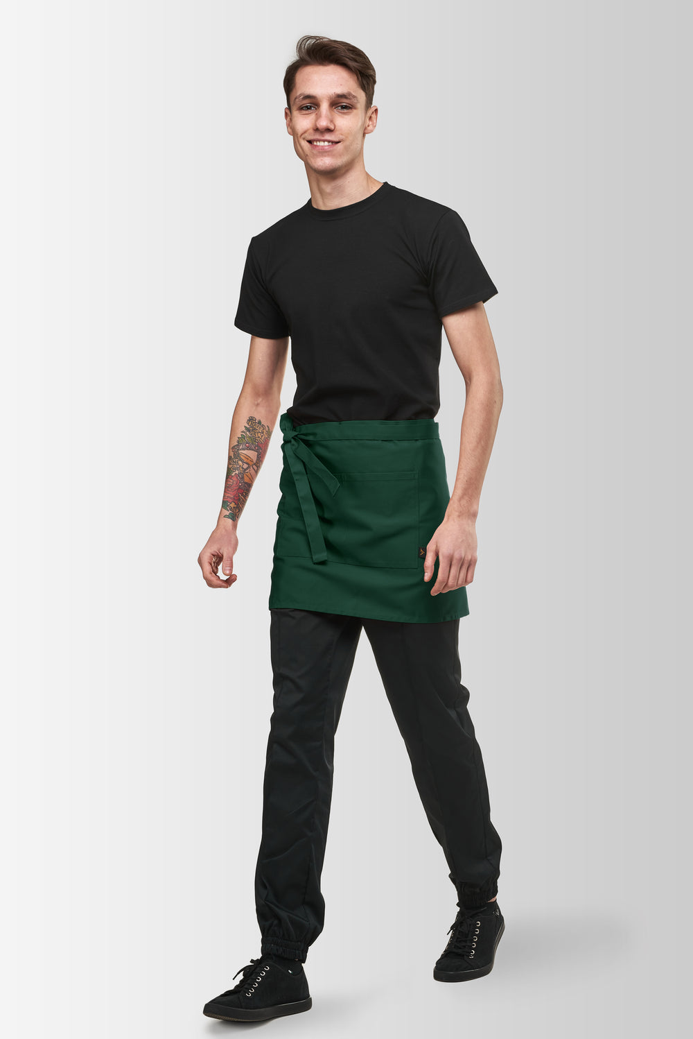 Green Berry short waist apron worn by a male model, three-quarter front view