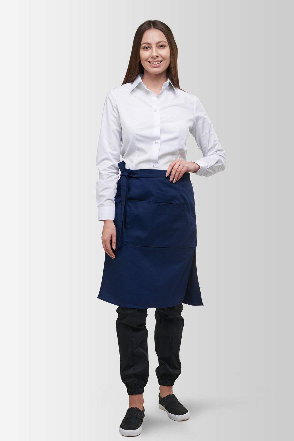 Dark Blue Tiramisu waist apron worn by a female model, front view