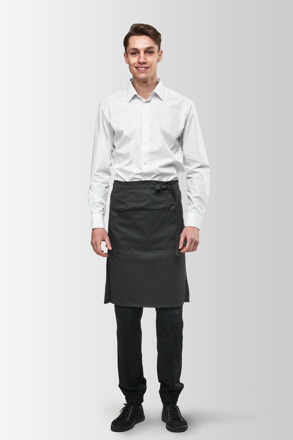 Dark Gray Tiramisu waist apron worn by a male model, front view
