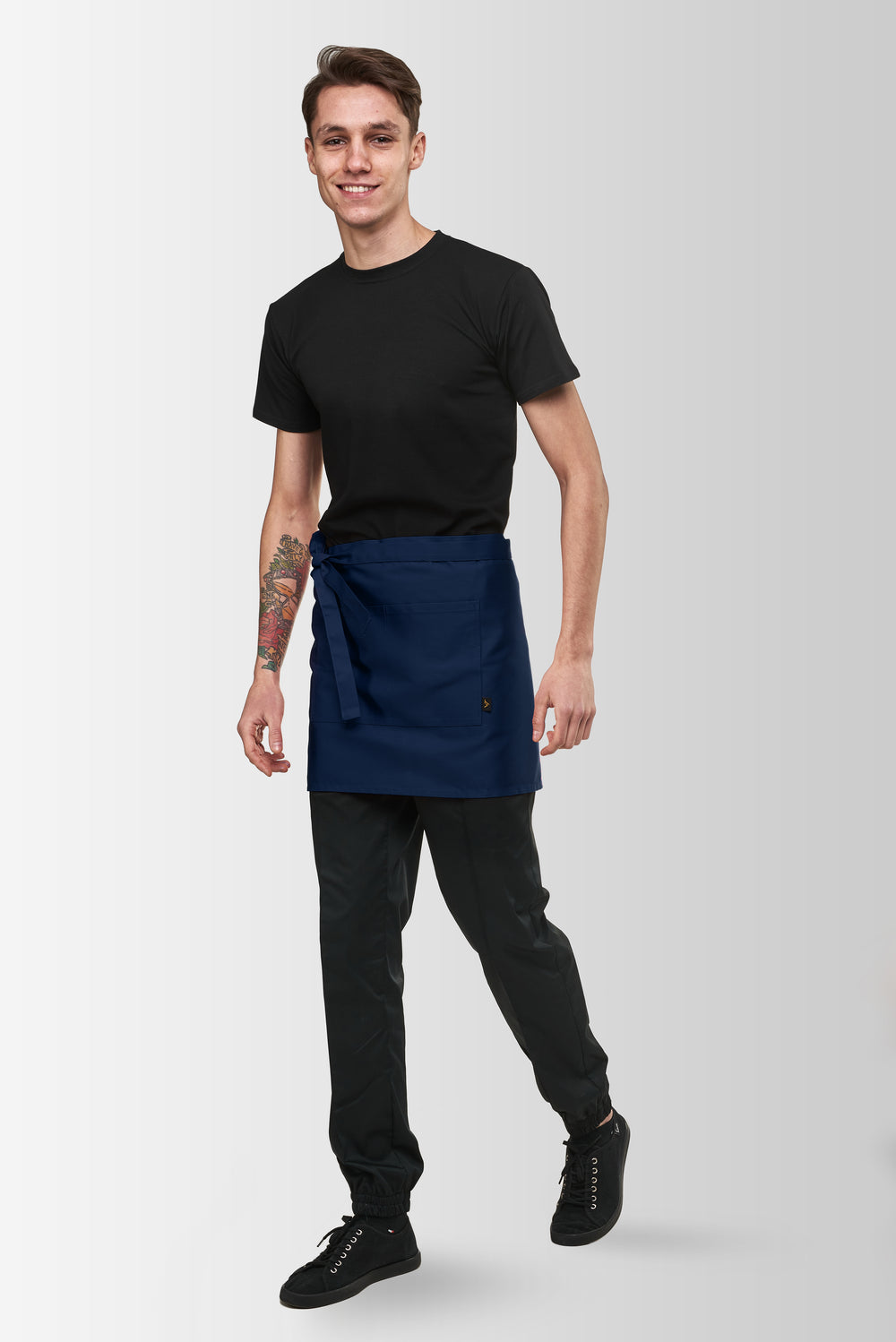 Dark Blue Berry short waist apron worn by a male model, three-quarter front view