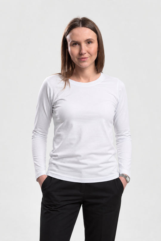 A woman modeling a plain white long-sleeve crewneck t-shirt against a light gray studio background.