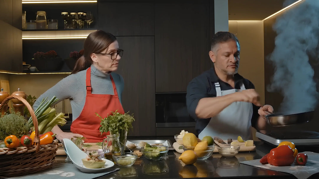 Two chefs wearing VSETEX aprons while preparing food