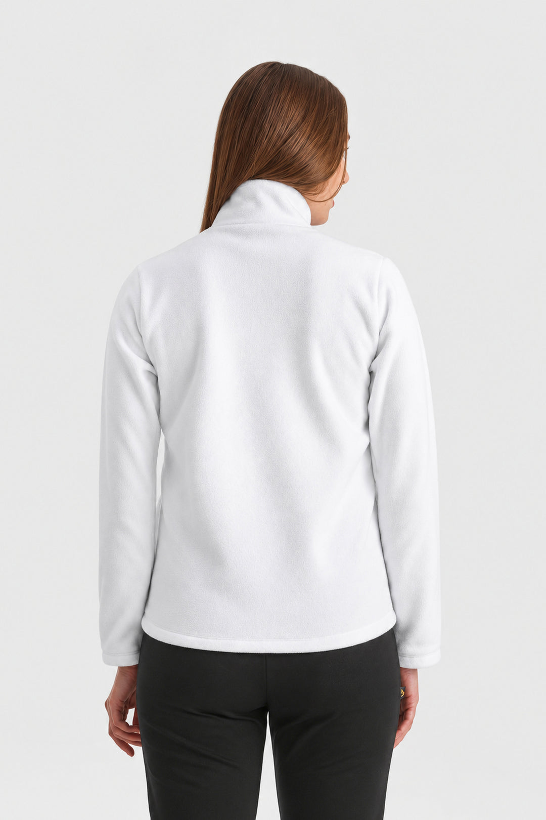 A woman viewed from the back wearing a white long-sleeve mock-neck fleece jacket and black pants, set against a plain light gray studio background.