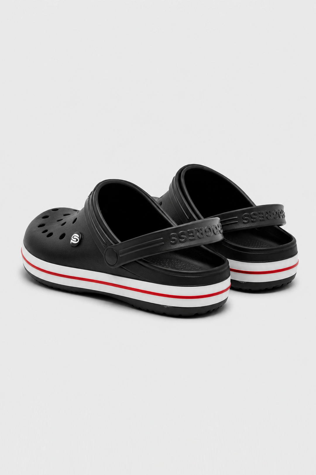 A pair of black Croc-style clogs with a white midsole stripe and a thin red accent line, photographed on a light gray background.