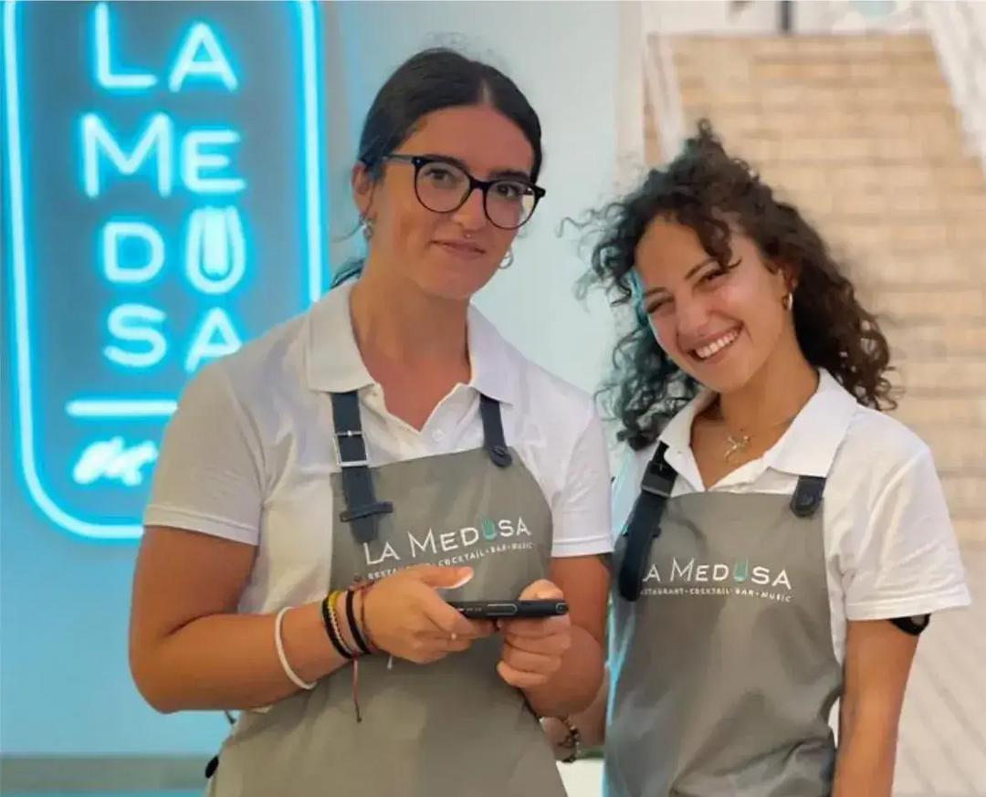 Service team wearing grey aprons with printed company logo