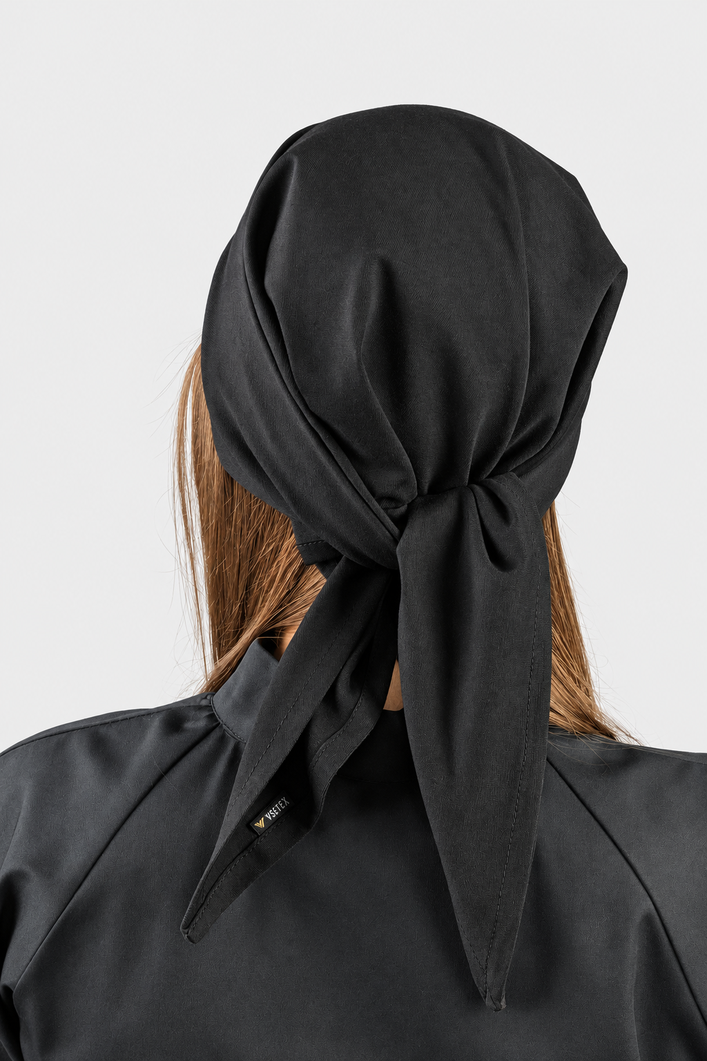 Rear view of a black VSETEX elastic chef bandana showing the knot and tie ends